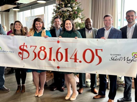 TD SYNNEX Share the Magic presents a check to Pendleton Place.