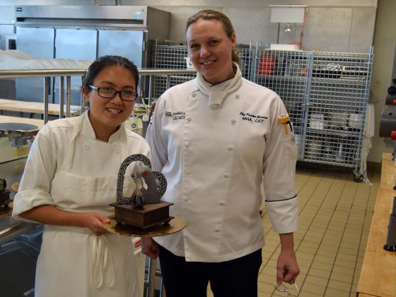 Chef Kristen Grissom and proud student with a chocolate